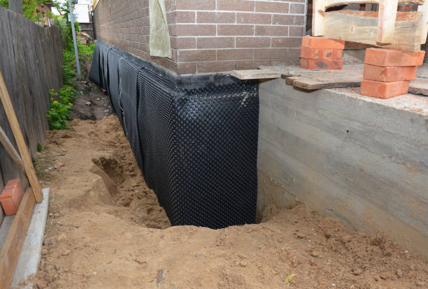 Happy homeowners after waterproofing job in Trufant